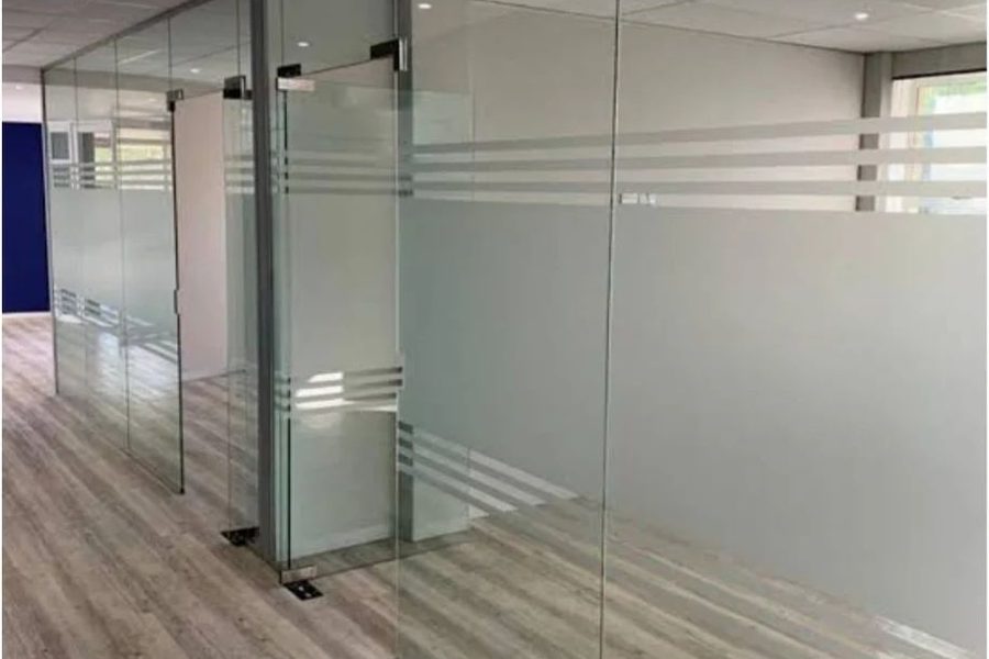 Slim framed glass partition with black aluminium profiles
