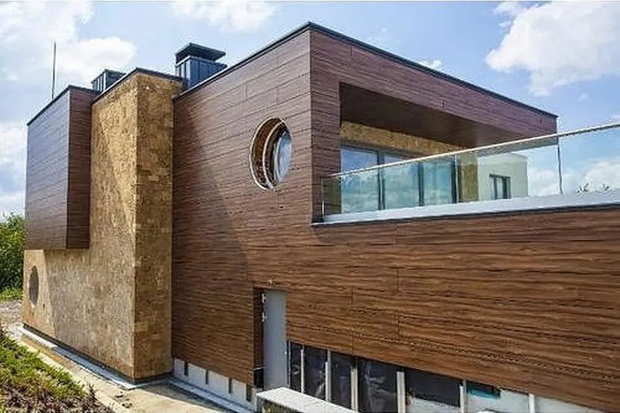Wood-finish HPL cladding on a residential elevation