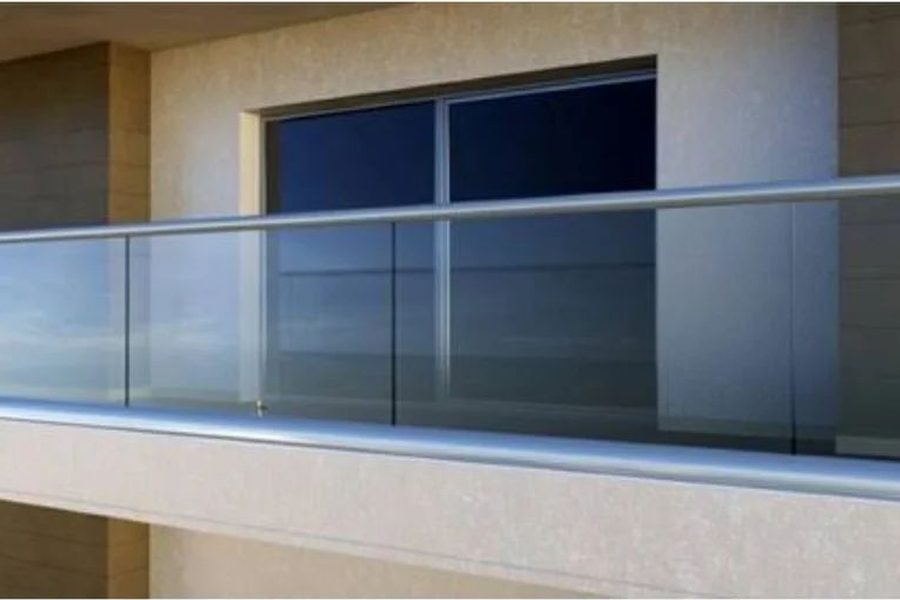 Glass balcony railing on stainless steel spigots