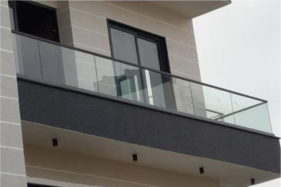 Stainless steel posts with glass infill panels and a top handrail