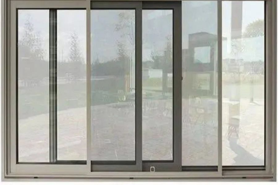 Aluminium sliding window looking on to a garden